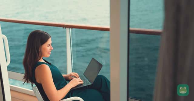 A guest using a laptop aboard an MSC ship, shown as a representative connectivity photo. MSC Concierge features must be checked for the actual ship.