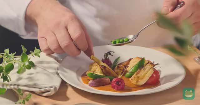 A chef plates a dish for Seabourn's Earth & Ocean program. Photo: Seabourn.