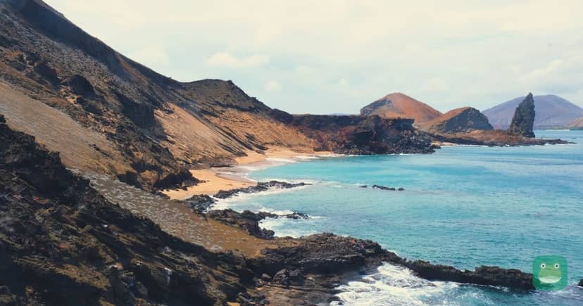 Galápagos — volcanic hills of Bartolomé Island beside the sea